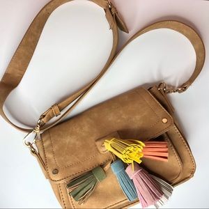 Tan leather cross body bag with pastel tassels